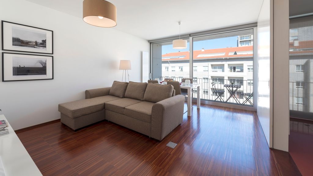 Casas Brancas w/ Balcony & Parking by LovelyStay