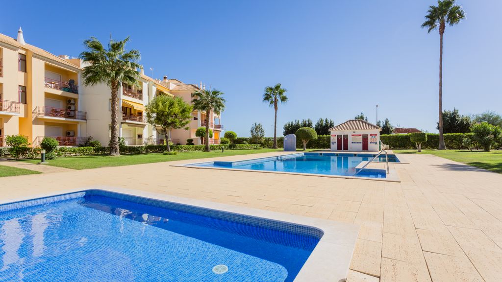 Serene Apartment W/ Balcony and Pool by LovelyStay