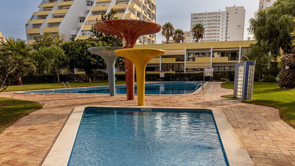 Beachfront 1 BDR Apartment With Pool by LovelyStay