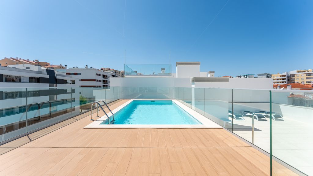 Modern 2BR w/ Rooftop Pool & Parking by LovelyStay