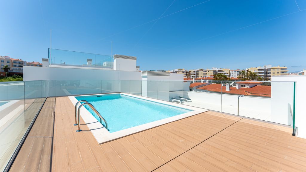 Modern 2BR w/ Rooftop Pool & Parking by LovelyStay