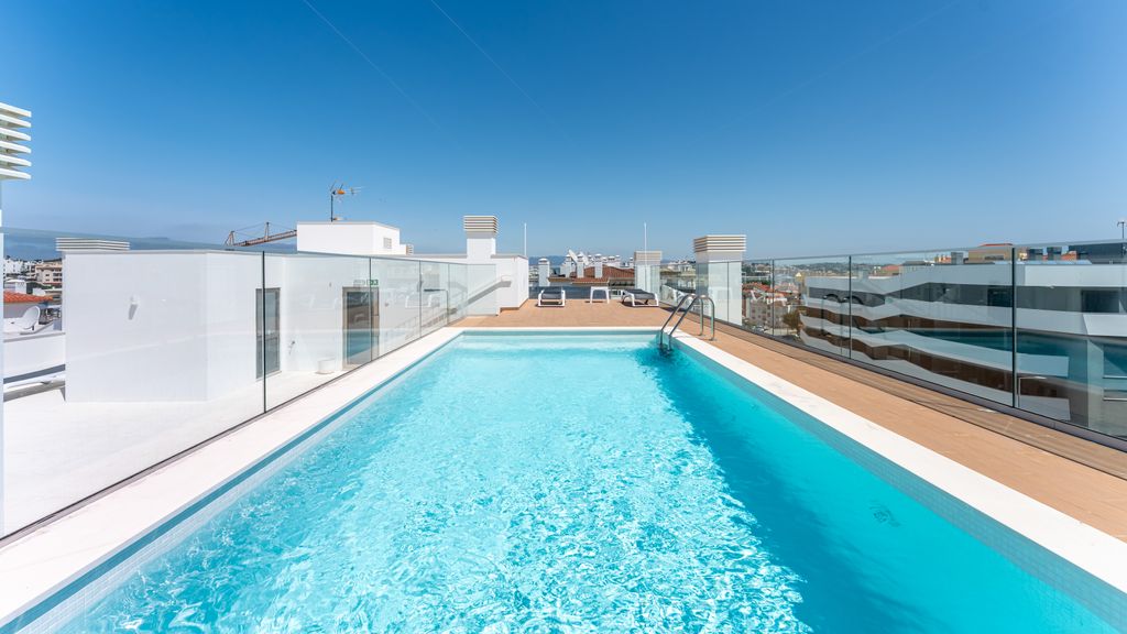 Modern 2BR w/ Rooftop Pool & Parking by LovelyStay