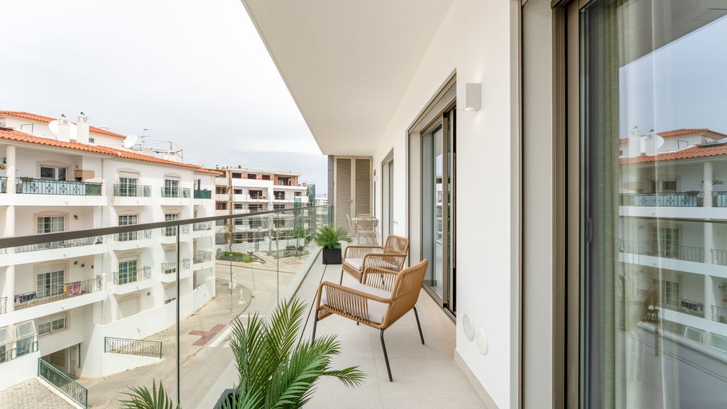 Modern 2BR w/ Rooftop Pool & Parking by LovelyStay