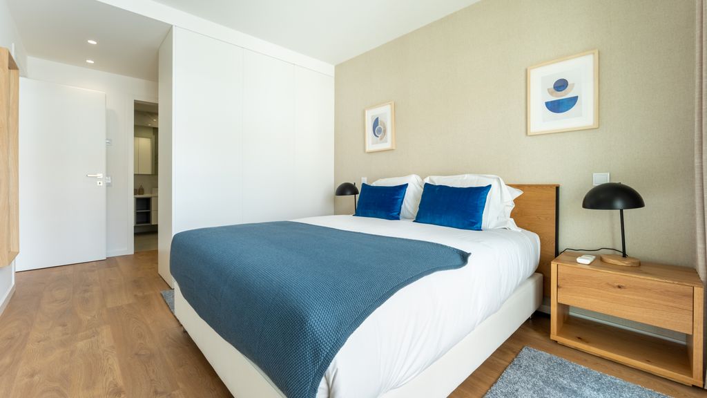 Modern 2BR w/ Rooftop Pool & Parking by LovelyStay