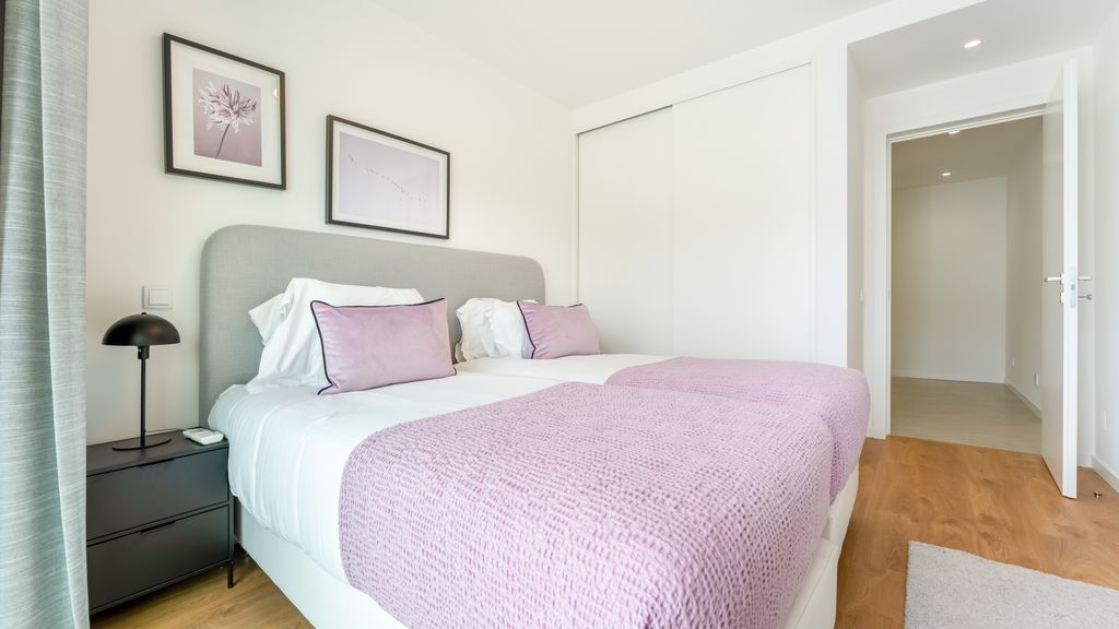 Modern 2BR w/ Rooftop Pool & Parking by LovelyStay
