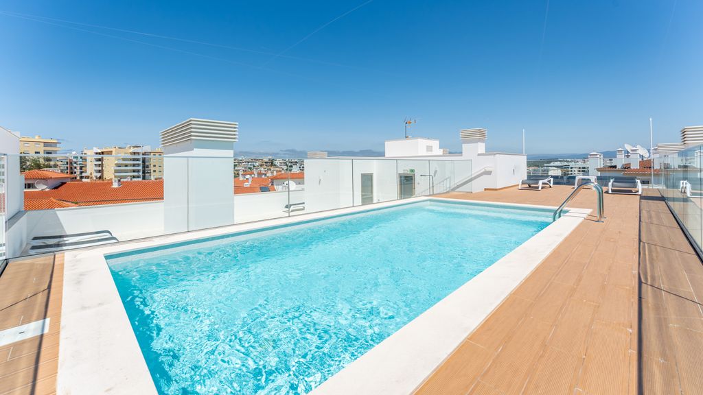 Modern 2BR w/ Rooftop Pool & Parking by LovelyStay